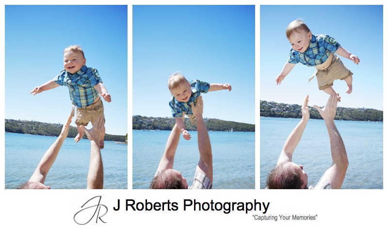 Dad throwing little boy in the air and laughing - sydney family portrait photographer